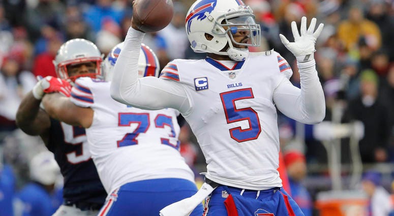 Dec 24, 2017; Foxborough, MA, USA; Buffalo Bills quarterback Tyrod Taylor (5) throws a pass against the New England Patriots in the second half at Gillette Stadium. Mandatory Credit: David Butler II-USA TODAY Sports Dec 24, 2017; Foxborough, MA, USA; Buffalo Bills quarterback Tyrod Taylor (5) throws a pass against the New England Patriots in the second half at Gillette Stadium. Mandatory Credit: David Butler II-USA TODAY Sports