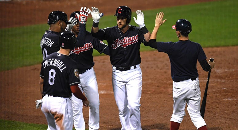 Mar 7, 2018; Goodyear, AZ, USA; Cleveland Indians catcher Yan Gomes (7) celebrates a grand slam against the Chicago Cubs with teammates during the third inning at Goodyear Ballpark. Mandatory Credit: Joe Camporeale-USA TODAY Sports