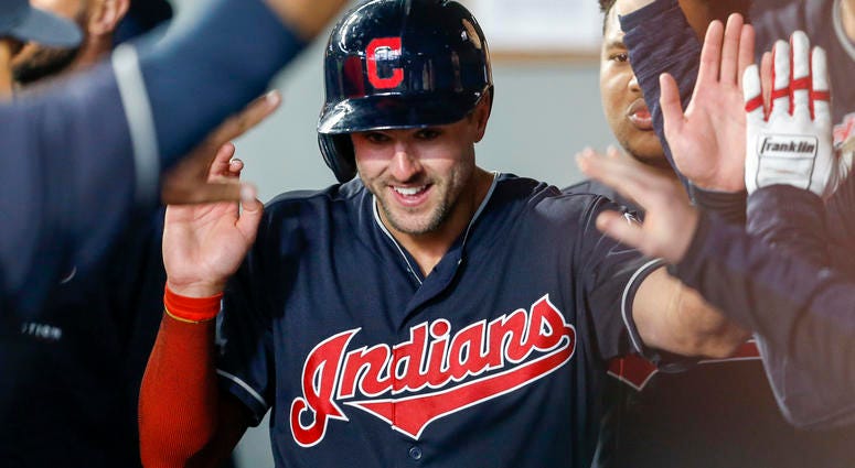 Apr 1, 2018; Seattle, WA, USA; Cleveland Indians right fielder Lonnie Chisenhall (8) is greeted in the dugout after scoring a run against the Seattle Mariners during the second inning at Safeco Field. Apr 1, 2018; Seattle, WA, USA; Cleveland Indians right fielder Lonnie Chisenhall (8) is greeted in the dugout after scoring a run against the Seattle Mariners during the second inning at Safeco Field.