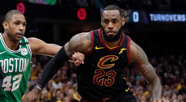 Cleveland Cavaliers' LeBron James (23) drives past Boston Celtics' Al Horford (42), from Dominican Republic, in the first half of Game 4 of the NBA basketball Eastern Conference finals, Monday, May 21, 2018, in Cleveland. Cleveland Cavaliers' LeBron James (23) drives past Boston Celtics' Al Horford (42), from Dominican Republic, in the first half of Game 4 of the NBA basketball Eastern Conference finals, Monday, May 21, 2018, in Cleveland.
