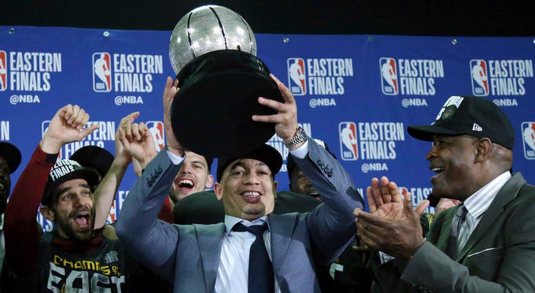 Cleveland Cavaliers head coach Tyronn Lue hoists the trophy after beating the Boston Celtics 87-79 in Game 7 of the NBA basketball Eastern Conference finals, Sunday, May 27, 2018, in Boston. Cleveland Cavaliers head coach Tyronn Lue hoists the trophy after beating the Boston Celtics 87-79 in Game 7 of the NBA basketball Eastern Conference finals, Sunday, May 27, 2018, in Boston.