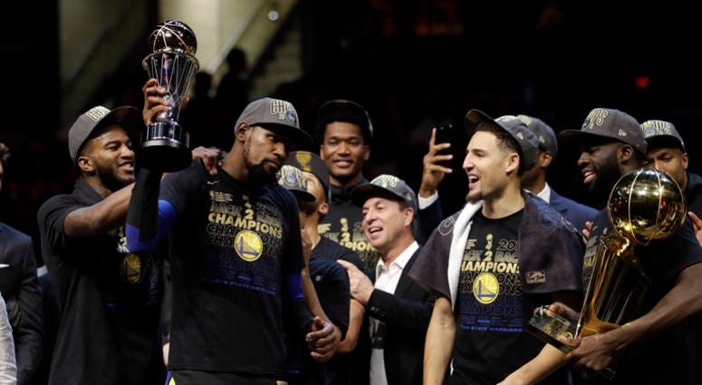 Golden State Warriors' Kevin Durant, second from left, celebrates after the Warriors defeated the Cleveland Cavaliers 108-85 in Game 4 of basketball's NBA Finals to win the NBA championship, Friday, June 8, 2018, in Cleveland. Golden State Warriors' Kevin Durant, second from left, celebrates after the Warriors defeated the Cleveland Cavaliers 108-85 in Game 4 of basketball's NBA Finals to win the NBA championship, Friday, June 8, 2018, in Cleveland.