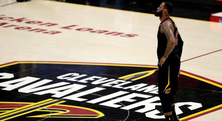 LeBron James watches during the first half of Game 4 of basketball's NBA Finals against the Golden State Warriors, in Cleveland. James has until June 29 to exercise his $35.6 million contract option for next season or decline it and become a free agent LeBron James watches during the first half of Game 4 of basketball's NBA Finals against the Golden State Warriors, in Cleveland. James has until June 29 to exercise his $35.6 million contract option for next season or decline it and become a free agent