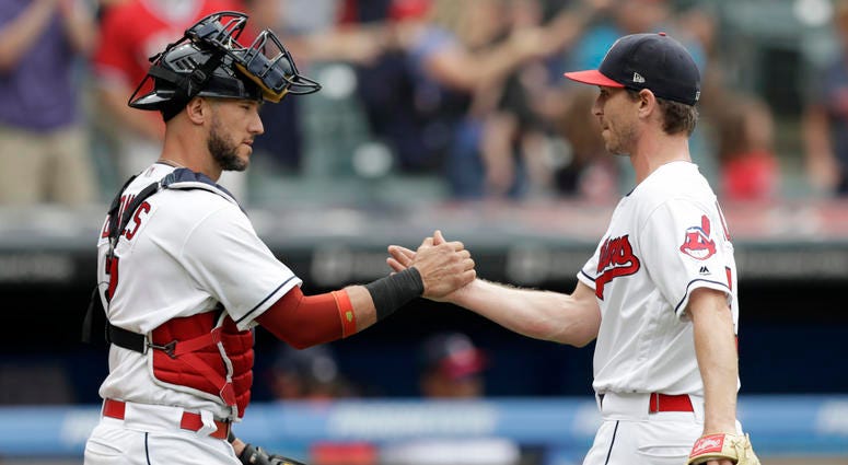 Cleveland Indians' Yan Gomes, left, and relief pitcher Josh Tomlin celebrate after the Indians defeated the Chicago White Sox 12-0 in a baseball game, Wednesday, June 20, 2018, in Cleveland. Cleveland Indians' Yan Gomes, left, and relief pitcher Josh Tomlin celebrate after the Indians defeated the Chicago White Sox 12-0 in a baseball game, Wednesday, June 20, 2018, in Cleveland.