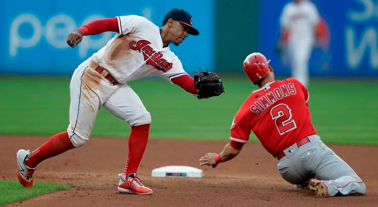 Cleveland Indians' Francisco Lindor, left, cannot make the tag as Los Angeles Angels' Andrelton Simmons slides safely into second base in the fourth inning of a baseball game, Saturday, Aug. 4, 2018, in Cleveland. Cleveland Indians' Francisco Lindor, left, cannot make the tag as Los Angeles Angels' Andrelton Simmons slides safely into second base in the fourth inning of a baseball game, Saturday, Aug. 4, 2018, in Cleveland.