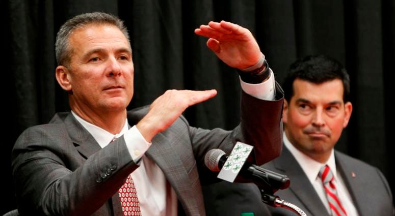 Ohio State NCAA college football head coach coach Urban Meyer, left, answers questions during a news conference announcing his retirement Tuesday, Dec. 4, 2018, in Columbus, Ohio. At right is assistant coach Ryan Day. Ohio State NCAA college football head coach coach Urban Meyer, left, answers questions during a news conference announcing his retirement Tuesday, Dec. 4, 2018, in Columbus, Ohio. At right is assistant coach Ryan Day.