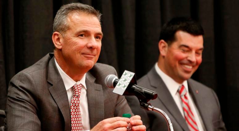 Ohio State NCAA college football head coach Urban Meyer, left, answers questions during a news conference announcing his retirement Tuesday, Dec. 4, 2018, in Columbus, Ohio. At right is assistant coach Ryan Day. Ohio State NCAA college football head coach Urban Meyer, left, answers questions during a news conference announcing his retirement Tuesday, Dec. 4, 2018, in Columbus, Ohio. At right is assistant coach Ryan Day.