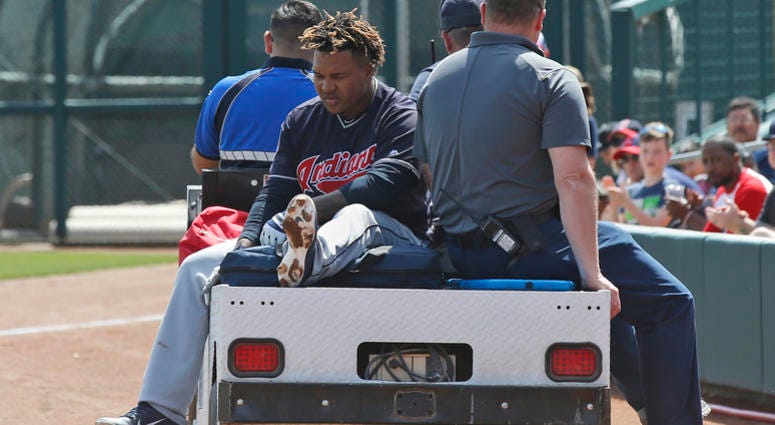 Cleveland Indians' Jose Ramirez is taken off the field on a cart after an injury during the third inning of the team's spring training baseball game against the Chicago White Sox on Sunday, March 24, 2019, in Glendale, Ariz.