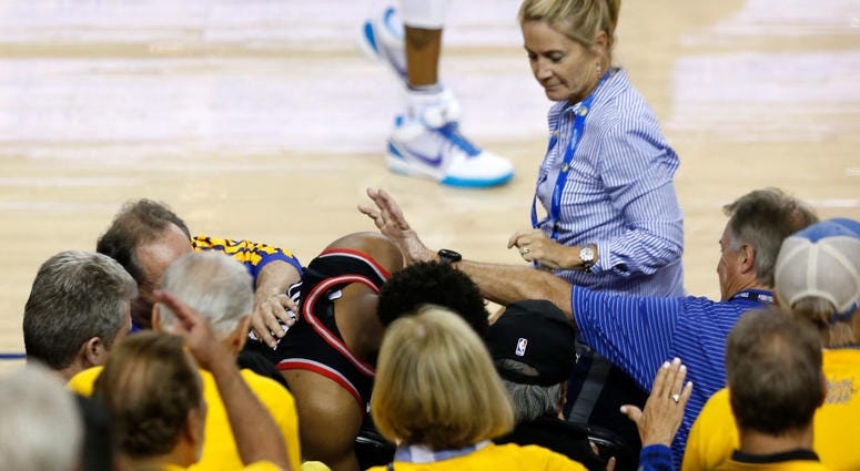 OAKLAND, CALIFORNIA - JUNE 05: Kyle Lowry #7 of the Toronto Raptors is pushed by Warriors minority investor Mark Stevens (blue shirt) after falling into the seats after a play against the Golden State Warriors in the second half during Game Three of the 2 OAKLAND, CALIFORNIA - JUNE 05: Kyle Lowry #7 of the Toronto Raptors is pushed by Warriors minority investor Mark Stevens (blue shirt) after falling into the seats after a play against the Golden State Warriors in the second half during Game Three of the 2