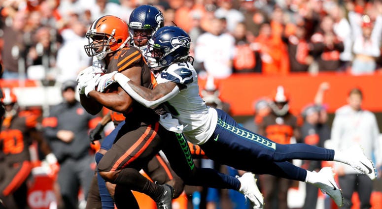 CLEVELAND, OH - OCTOBER 13: Shaquill Griffin #26 of the Seattle Seahawks and Tre Flowers #21 combine to tackle Nick Chubb #24 of the Cleveland Browns during the first quarter at FirstEnergy Stadium on October 13, 2019 in Cleveland, Ohio. (Photo by Kirk Ir CLEVELAND, OH - OCTOBER 13: Shaquill Griffin #26 of the Seattle Seahawks and Tre Flowers #21 combine to tackle Nick Chubb #24 of the Cleveland Browns during the first quarter at FirstEnergy Stadium on October 13, 2019 in Cleveland, Ohio. (Photo by Kirk Ir