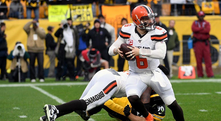 Baker Mayfield #6 of the Cleveland Browns scrambles out of the pocket in the second quarter during the game against the Pittsburgh Steelers at Heinz Field Baker Mayfield #6 of the Cleveland Browns scrambles out of the pocket in the second quarter during the game against the Pittsburgh Steelers at Heinz Field