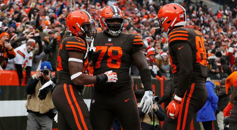 CLEVELAND, OH - DECEMBER 23: David Njoku #85 of the Cleveland Browns celebrates his touchdown with Greg Robinson #78 and Darren Fells #88 during the second quarter against the Cincinnati Bengals at FirstEnergy Stadium on December 23, 2018 in Cleveland, OH Browns tight end David Njoku (#85, left), Greg Robinson (#78, center) and Darren Fells (#88, right)