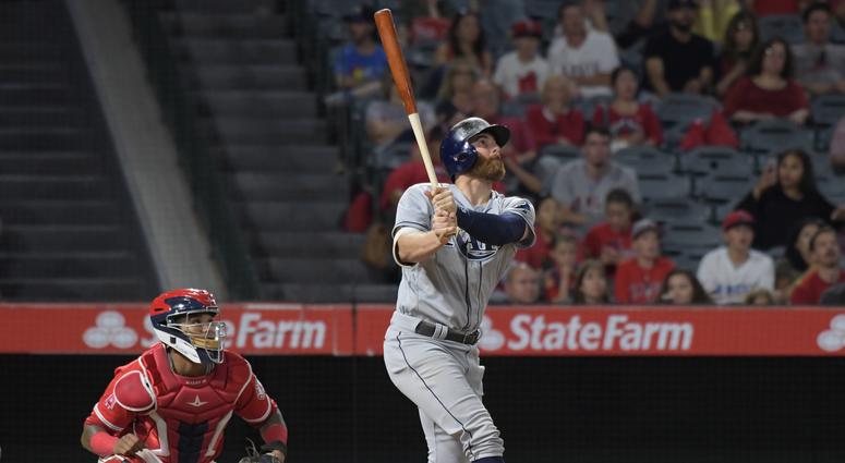 Jul 14, 2017; Anaheim, CA, USA; Tampa Bay Rays second baseman Brad Miller (13) follows through on a run-scoring single in the 10th inning as Los Angeles Angels catcher Martin Maldonado (12) watches during a MLB baseball game at Angel Stadium of Anaheim. Jul 14, 2017; Anaheim, CA, USA; Tampa Bay Rays second baseman Brad Miller (13) follows through on a run-scoring single in the 10th inning as Los Angeles Angels catcher Martin Maldonado (12) watches during a MLB baseball game at Angel Stadium of Anaheim.