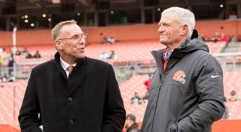 Cleveland, OH, USA; Cleveland Browns general manager John Dorsey, left, talks with team owner Jimmy Haslam during warmups before the game against the Green Bay Packers at FirstEnergy Stadium