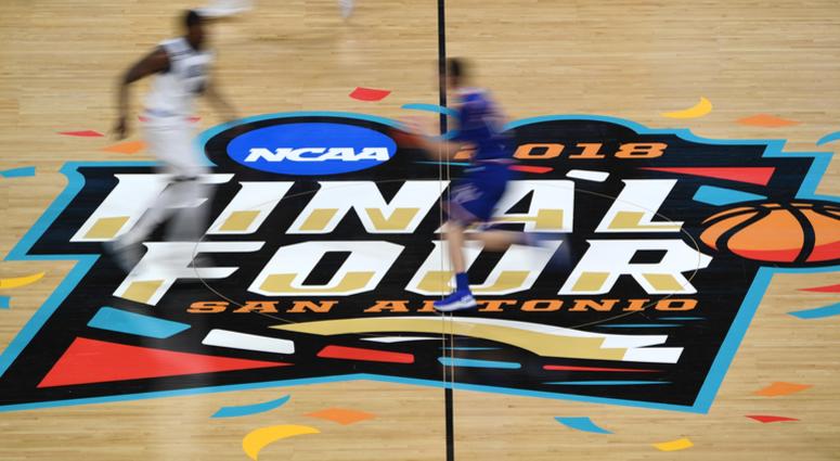Kansas Jayhawks and Villanova Wildcats cross the center court logo in the first half in the semifinals of the 2018 men's Final Four at Alamodome. Kansas Jayhawks and Villanova Wildcats cross the center court logo in the first half in the semifinals of the 2018 men's Final Four at Alamodome.