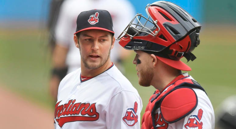 Apr 12, 2018; Cleveland, OH, USA; Cleveland Indians starting pitcher Trevor Bauer (47) walks to the dugout with catcher Roberto Perez (55) in the first inning at Progressive Field. Apr 12, 2018; Cleveland, OH, USA; Cleveland Indians starting pitcher Trevor Bauer (47) walks to the dugout with catcher Roberto Perez (55) in the first inning at Progressive Field.