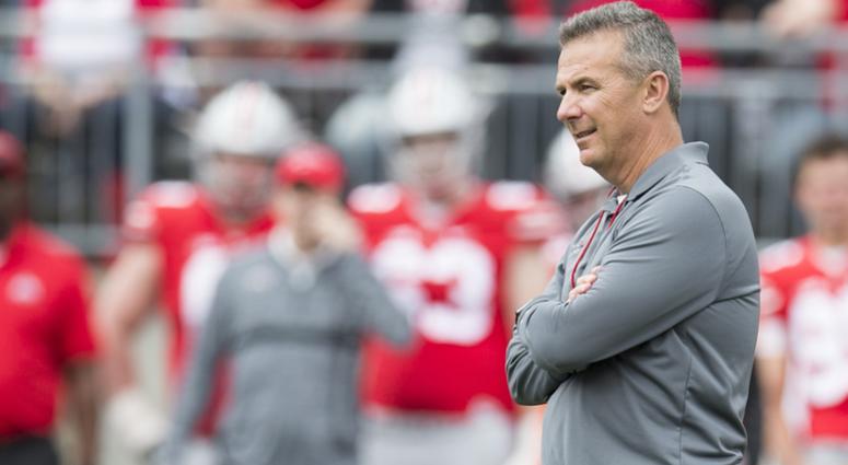 Ohio State Buckeyes head coach Urban Meyer watches as his team competes in the Spring Game at Ohio Stadium. Ohio State Buckeyes head coach Urban Meyer watches as his team competes in the Spring Game at Ohio Stadium.