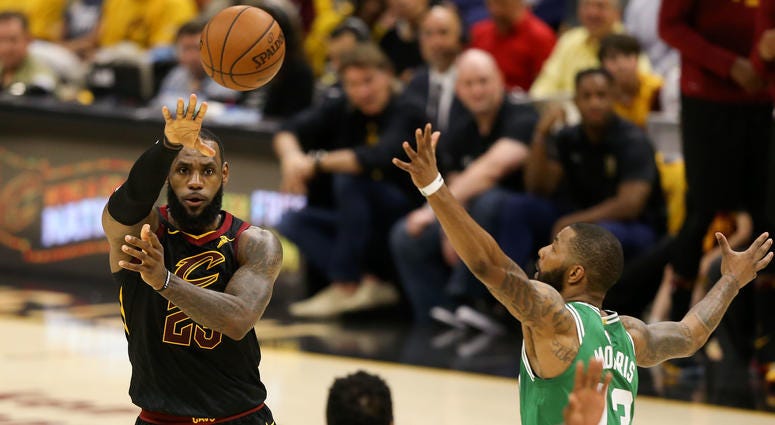 Cavaliers forward LeBron James (23) passes the ball in front of Boston Celtics forward Marcus Morris (13) during the first quarter in game three of the Eastern conference finals of the 2018 NBA Playoffs at Quicken Loans Arena. Cavaliers forward LeBron James (23) passes the ball in front of Boston Celtics forward Marcus Morris (13) during the first quarter in game three of the Eastern conference finals of the 2018 NBA Playoffs at Quicken Loans Arena.