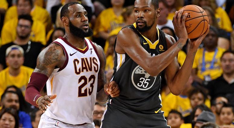 Golden State Warriors forward Kevin Durant (35) handles the ball against Cleveland Cavaliers forward LeBron James (23) during the second quarter in game two of the 2018 NBA Finals Golden State Warriors forward Kevin Durant (35) handles the ball against Cleveland Cavaliers forward LeBron James (23) during the second quarter in game two of the 2018 NBA Finals