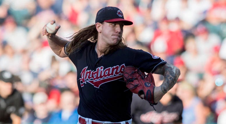 Jul 9, 2018; Cleveland, OH, USA; Cleveland Indians starting pitcher Mike Clevinger (52) throws a pitch during the second inning against the Cincinnati Reds at Progressive Field. Jul 9, 2018; Cleveland, OH, USA; Cleveland Indians starting pitcher Mike Clevinger (52) throws a pitch during the second inning against the Cincinnati Reds at Progressive Field.