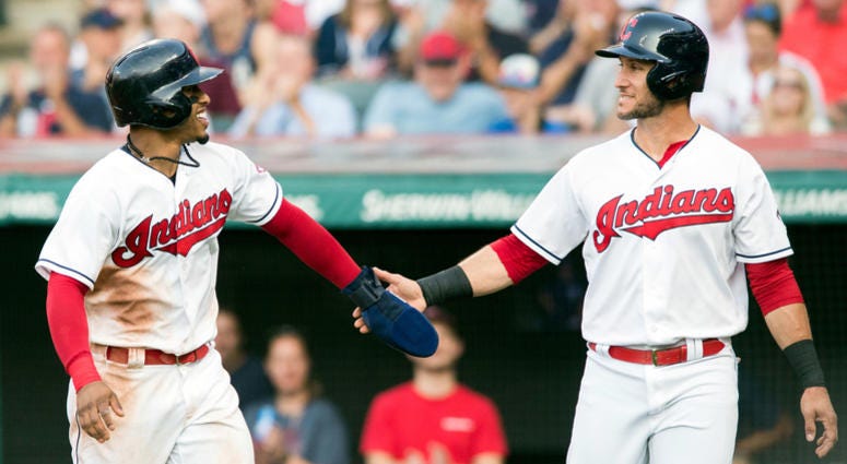 Jul 13, 2018; Cleveland, OH, USA; Cleveland Indians shortstop Francisco Lindor (12) and catcher Yan Gomes (7) celebrate after scoring during the second inning against the New York Yankees at Progressive Field. Jul 13, 2018; Cleveland, OH, USA; Cleveland Indians shortstop Francisco Lindor (12) and catcher Yan Gomes (7) celebrate after scoring during the second inning against the New York Yankees at Progressive Field.