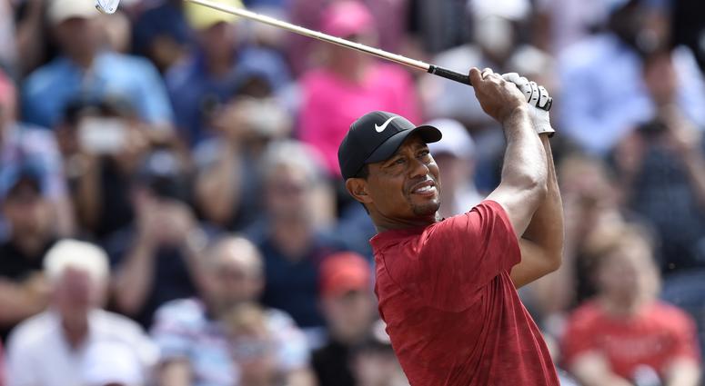 Tiger Woods plays his shot from the third tee during the final round of The Open Championship golf tournament at Carnoustie Golf Links. Tiger Woods plays his shot from the third tee during the final round of The Open Championship golf tournament at Carnoustie Golf Links.