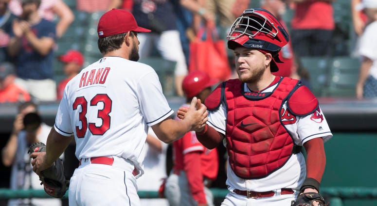 Aug 5, 2018; Cleveland, OH, USA; Cleveland Indians relief pitcher Brad Hand (33) and catcher Roberto Perez (55) celebrate after the Indians beat the Los Angeles Angels at Progressive Field. Aug 5, 2018; Cleveland, OH, USA; Cleveland Indians relief pitcher Brad Hand (33) and catcher Roberto Perez (55) celebrate after the Indians beat the Los Angeles Angels at Progressive Field.