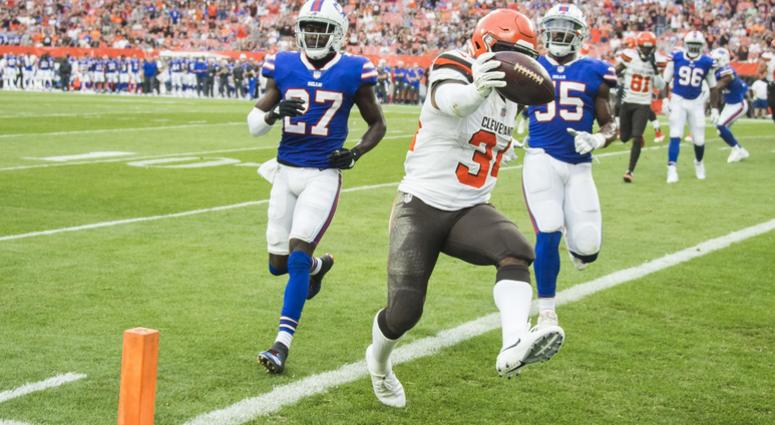 Cleveland Browns running back Carlos Hyde (34) scores a touchdown as Buffalo Bills cornerback Tre'Davious White (27) and defensive end Jerry Hughes (55) pursue during the first quarter at FirstEnergy Stadium. Cleveland Browns running back Carlos Hyde (34) scores a touchdown as Buffalo Bills cornerback Tre'Davious White (27) and defensive end Jerry Hughes (55) pursue during the first quarter at FirstEnergy Stadium.