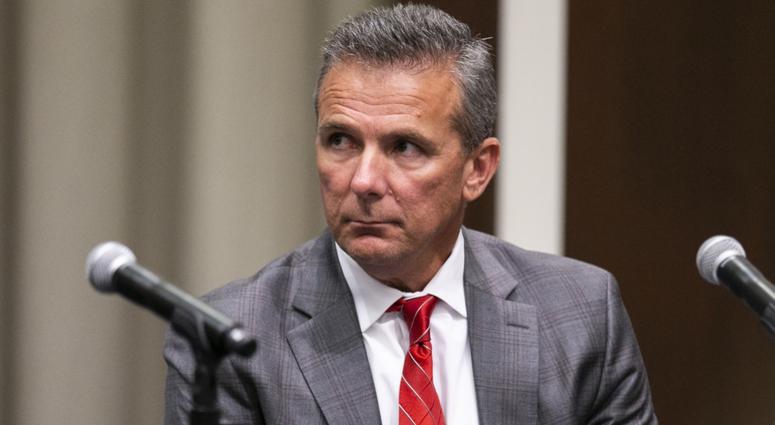 Ohio State Buckeyes head coach Urban Meyer listens as university president Michael Drake at Longaberger Alumni House speaks on the Ohio State University campus. Ohio State Buckeyes head coach Urban Meyer listens as university president Michael Drake at Longaberger Alumni House speaks on the Ohio State University campus.