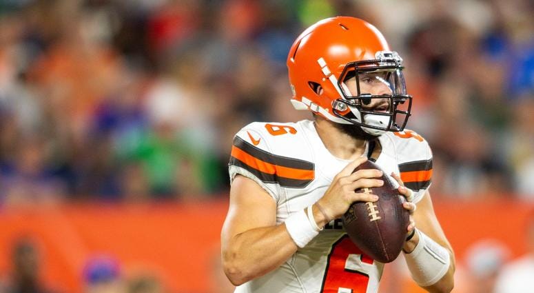 Cleveland Browns quarterback Baker Mayfield (6) looks for an open receiver against the Philadelphia Eagles during the first quarter at FirstEnergy Stadium. Cleveland Browns quarterback Baker Mayfield (6) looks for an open receiver against the Philadelphia Eagles during the first quarter at FirstEnergy Stadium.