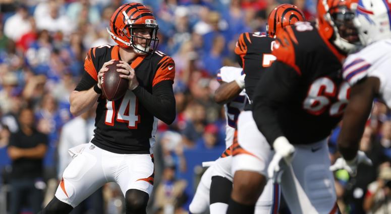 Cincinnati Bengals quarterback Andy Dalton (14) looks to throw a pass during the first half against the Buffalo Bills at New Era Field. Cincinnati Bengals quarterback Andy Dalton (14) looks to throw a pass during the first half against the Buffalo Bills at New Era Field.