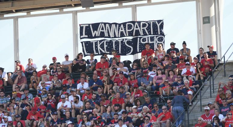 Fans display a sign in the game between the Cleveland Indians and the Houston Astros during game three of the 2018 ALDS playoff baseball series at Progressive Field.