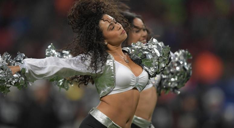 Oakland Raiders raiderette cheerleaders perform during an NFL International Series game against the Seattle Seahawks at Wembley Stadium. Oakland Raiders raiderette cheerleaders perform during an NFL International Series game against the Seattle Seahawks at Wembley Stadium.