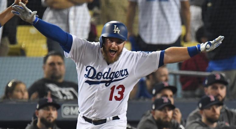 Los Angeles Dodgers first baseman Max Muncy (13) celebrates with first base coach George Lombard (29) after hitting a solo home run against the Boston Red Sox in the eighteenth inning to win game three of the 2018 World Series at Dodger Stadium. Los Angeles Dodgers first baseman Max Muncy (13) celebrates with first base coach George Lombard (29) after hitting a solo home run against the Boston Red Sox in the eighteenth inning to win game three of the 2018 World Series at Dodger Stadium.