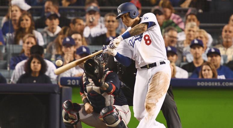 Oct 27, 2018; Los Angeles, CA, USA; Los Angeles Dodgers shortstop Manny Machado (8) hits a single against the Boston Red Sox in the eighth inning in game four of the 2018 World Series at Dodger Stadium. Mandatory Credit: Robert Hanashiro-USA TODAY Sports Oct 27, 2018; Los Angeles, CA, USA; Los Angeles Dodgers shortstop Manny Machado (8) hits a single against the Boston Red Sox in the eighth inning in game four of the 2018 World Series at Dodger Stadium. Mandatory Credit: Robert Hanashiro-USA TODAY Sports