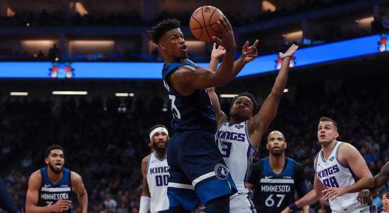 Minnesota Timberwolves guard Jimmy Butler (23) passes the ball against Sacramento Kings guard Yogi Ferrell (3) during the second quarter at Golden 1 Center. Minnesota Timberwolves guard Jimmy Butler (23) passes the ball against Sacramento Kings guard Yogi Ferrell (3) during the second quarter at Golden 1 Center.