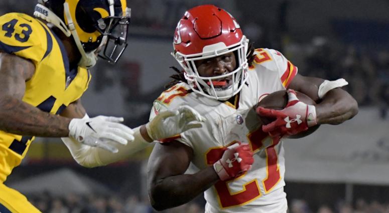 Los Angeles Rams strong safety John Johnson (43) tackles Kansas City Chiefs running back Kareem Hunt (27) during the first half at the Los Angeles Memorial Coliseum.