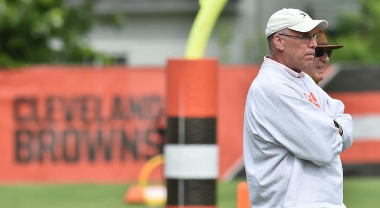 Cleveland Browns general manager John Dorsey and former Green Bay Packers general manger Ron Wolf watch the Browns practice during minicamp at the Cleveland Browns training facility.