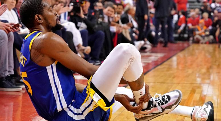 Golden State Warriors forward Kevin Durant (35) sits on the court after an apparent injury during the second quarter in game five against the Toronto Raptors of the 2019 NBA Finals at Scotiabank Arena. Golden State Warriors forward Kevin Durant (35) sits on the court after an apparent injury during the second quarter in game five against the Toronto Raptors of the 2019 NBA Finals at Scotiabank Arena.