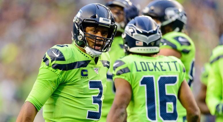 Seattle Seahawks quarterback Russell Wilson (3) and Seattle Seahawks wide receiver Tyler Lockett (16) during the during the first half against the Los Angeles Rams at CenturyLink Field. Seattle defeated Los Angeles 30-29. NFL: Los Angeles Rams at Seattle Seahawks