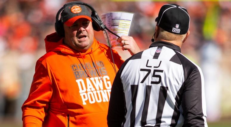 Cleveland Browns head coach Freddie Kitchens talks with side judge Rob Vernatchi (75) during the second quarter at FirstEnergy Stadium.