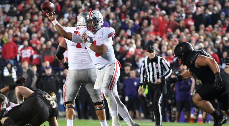 Ohio State Buckeyes quarterback Justin Fields (1) passes against the Northwestern Wildcats during the first half at Ryan Field. Ohio State Buckeyes quarterback Justin Fields (1)