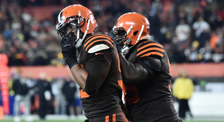 Cleveland Browns defensive tackle Devaroe Lawrence (99) leads defensive end Myles Garrett (95) off the field after a fight during the second half against the Pittsburgh Steelers at FirstEnergy Stadium. Cleveland Browns defensive tackle Devaroe Lawrence (99) leads defensive end Myles Garrett (95) off the field after a fight during the second half against the Pittsburgh Steelers at FirstEnergy Stadium.