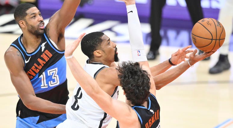 Nov 25, 2019; Cleveland, OH, USA; Brooklyn Nets guard Spencer Dinwiddie (8) shoots between Cleveland Cavaliers center Tristan Thompson (13) and forward Cedi Osman (16) in the fourth quarter at Rocket Mortgage FieldHouse. Brooklyn Nets guard Spencer Dinwiddie (8) shoots between Cleveland Cavaliers center Tristan Thompson (13) and forward Cedi Osman (16)