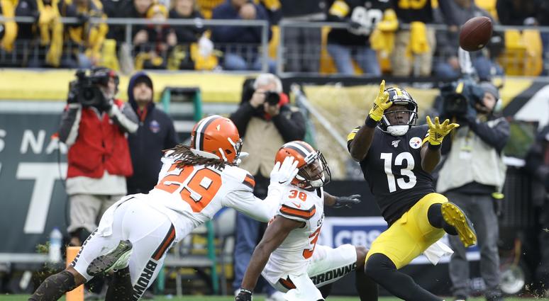Dec 1, 2019; Pittsburgh, PA, USA; Pittsburgh Steelers wide receiver James Washington (13) catches a touchdown pass against Cleveland Browns defensive back T.J. Carrie (38) and defensive back Sheldrick Redwine (29) during the second quarter at Heinz Field. Dec 1, 2019; Pittsburgh, PA, USA; Pittsburgh Steelers wide receiver James Washington (13) catches a touchdown pass against Cleveland Browns defensive back T.J. Carrie (38) and defensive back Sheldrick Redwine (29) during the second quarter at Heinz Field.