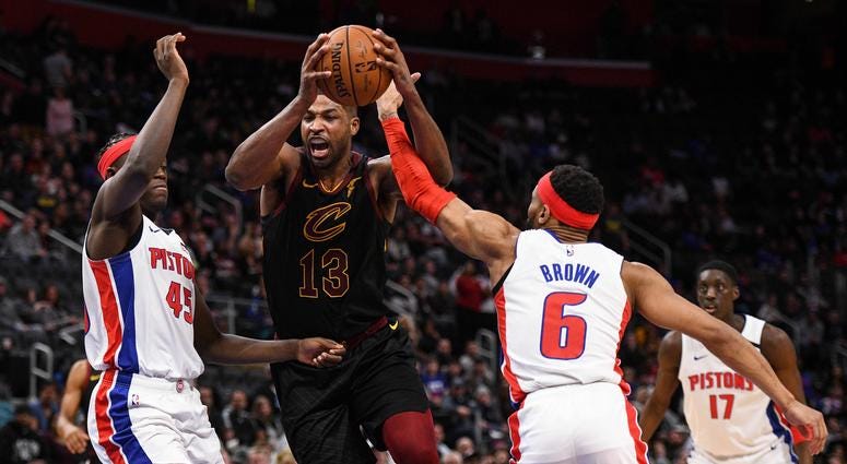 Cleveland Cavaliers center Tristan Thompson (13) drives to the basket against Detroit Pistons forward Sekou Doumbouya (45) and guard Bruce Brown (6) during the fourth quarter at Little Caesars Arena. Cleveland Cavaliers center Tristan Thompson (13) drives to the basket against Detroit Pistons forward Sekou Doumbouya (45) and guard Bruce Brown (6) during the fourth quarter at Little Caesars Arena.