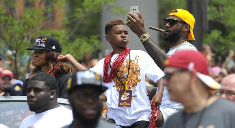 Cleveland Cavaliers forward LeBron James, son LeBron James Jr. and wife Savannah James, celebrate during the NBA championship parade in downtown Cleveland Cleveland Cavaliers forward LeBron James, son LeBron James Jr. and wife Savannah James, celebrate during the NBA championship parade in downtown Cleveland