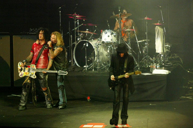 Bassist Nikki Sixx, lead singer Vince Neal, drummer Tommy Lee and guitarist Mick Mars of Motley Crue perform at the KROQ Weenie Roast 2005 Bassist Nikki Sixx, lead singer Vince Neal, drummer Tommy Lee and guitarist Mick Mars of Motley Crue perform at the KROQ Weenie Roast 2005