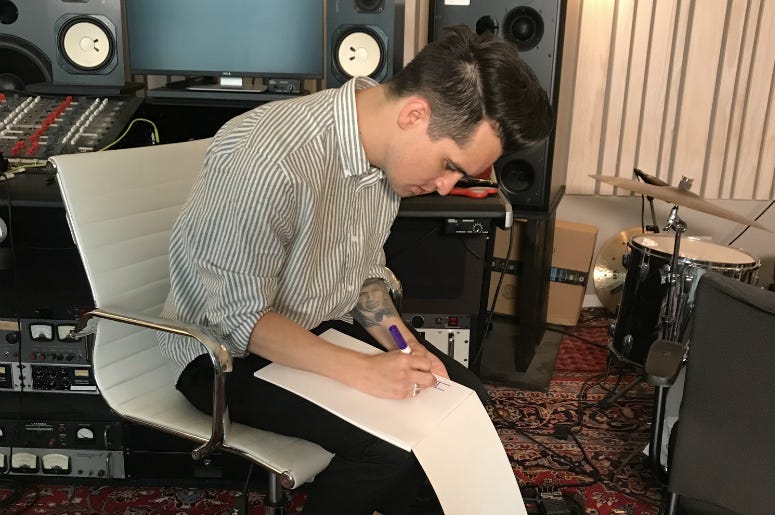 Brendon Urie from Panic! At The Disco drawing a mystery billboard Brendon Urie from Panic! At The Disco drawing a mystery billboard