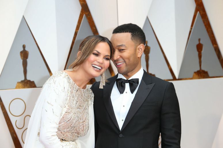 Chrissy Teigen and John Legend on the red carpet during the 89th Academy Awards at Dolby Theatre. Chrissy Teigen and John Legend on the red carpet during the 89th Academy Awards at Dolby Theatre.